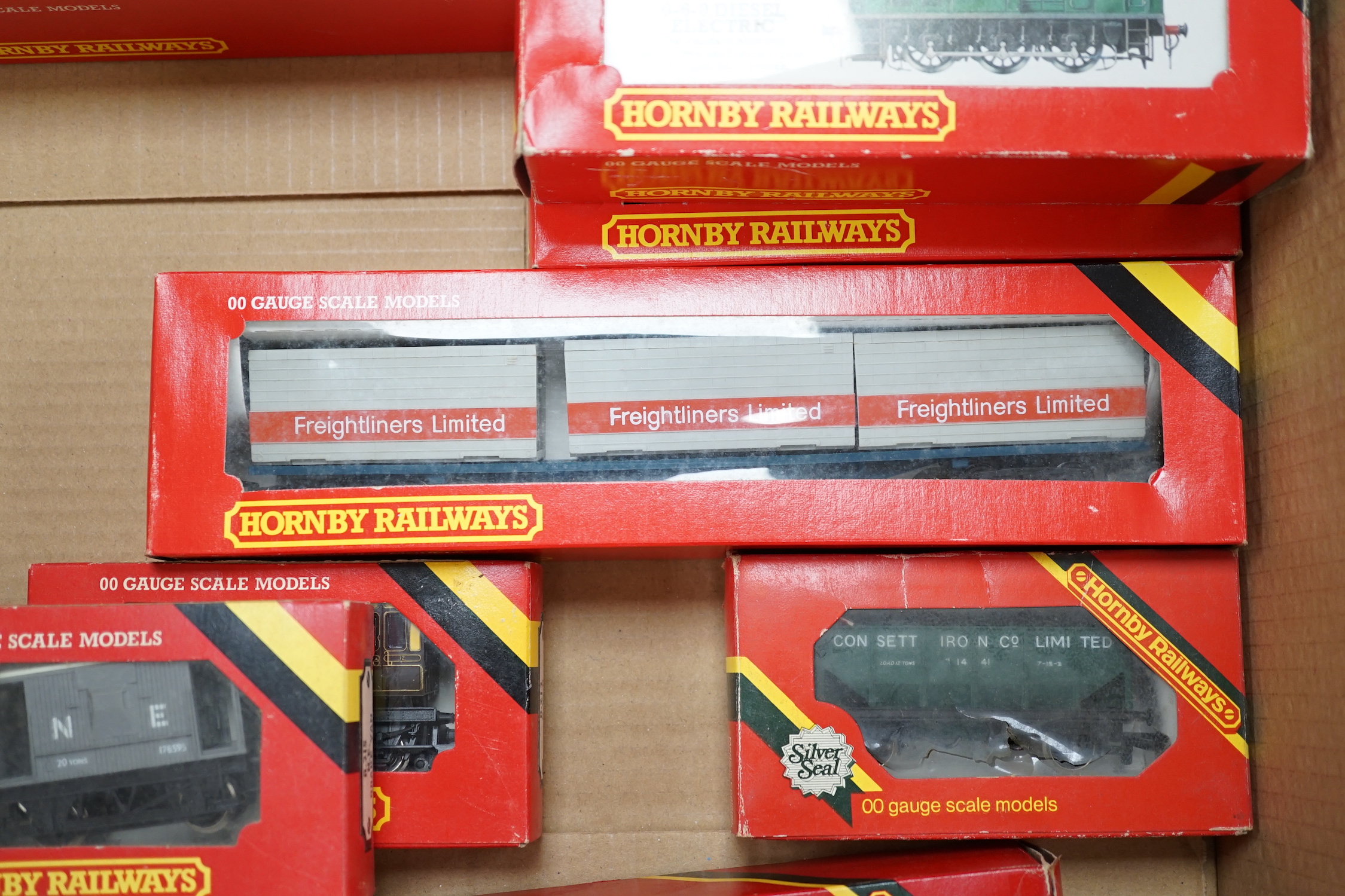 Thirty-six boxed Hornby railways 00 gauge items including five BR diesel locomotives; a Class 47 (R075), a Hymek (R074), a Class 25 (R068) and two Class 08 shunters (R156), together with fifteen freight wagons, twelve bo